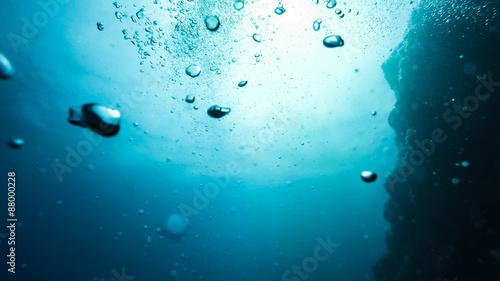  bubbles in water on a blue background, underwater photography