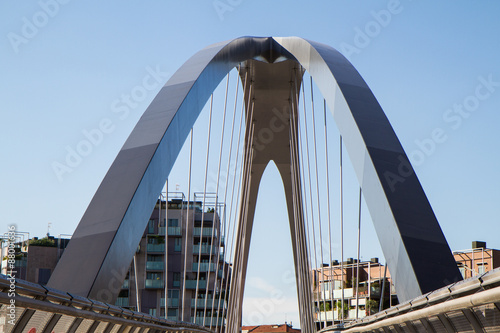 modern footbridge with supporting arches and steel bulkheads © kleem26