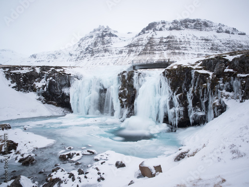  Kirkjufellsfos Waterfall in the winter in Iceland