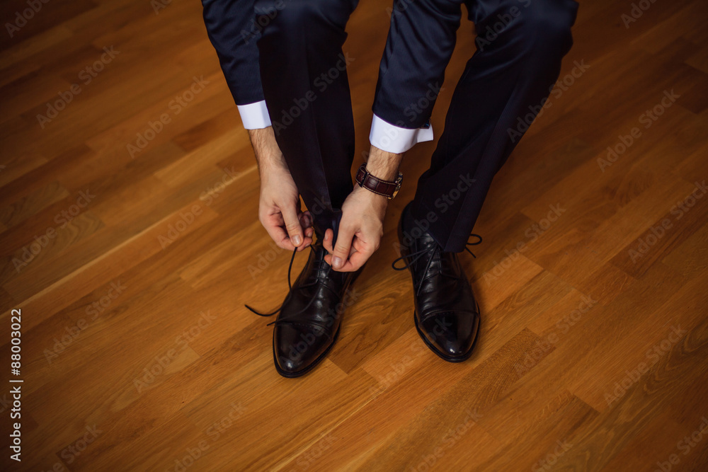 The man wears shoes. The man wears shoes.