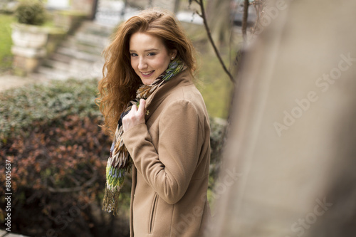 Young red hair woman at outdoors