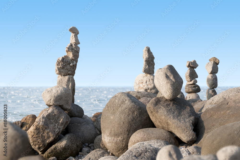 balancing stones on the beach in summer balancing stones on the beach in summer