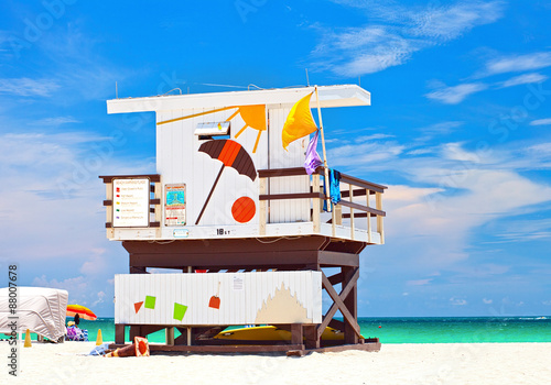 Miami Beach Florida, USA famous tropical travel location, typical Art Deco lifeguard house on a beautiful summer day with ocean and blue sky © FotoMak