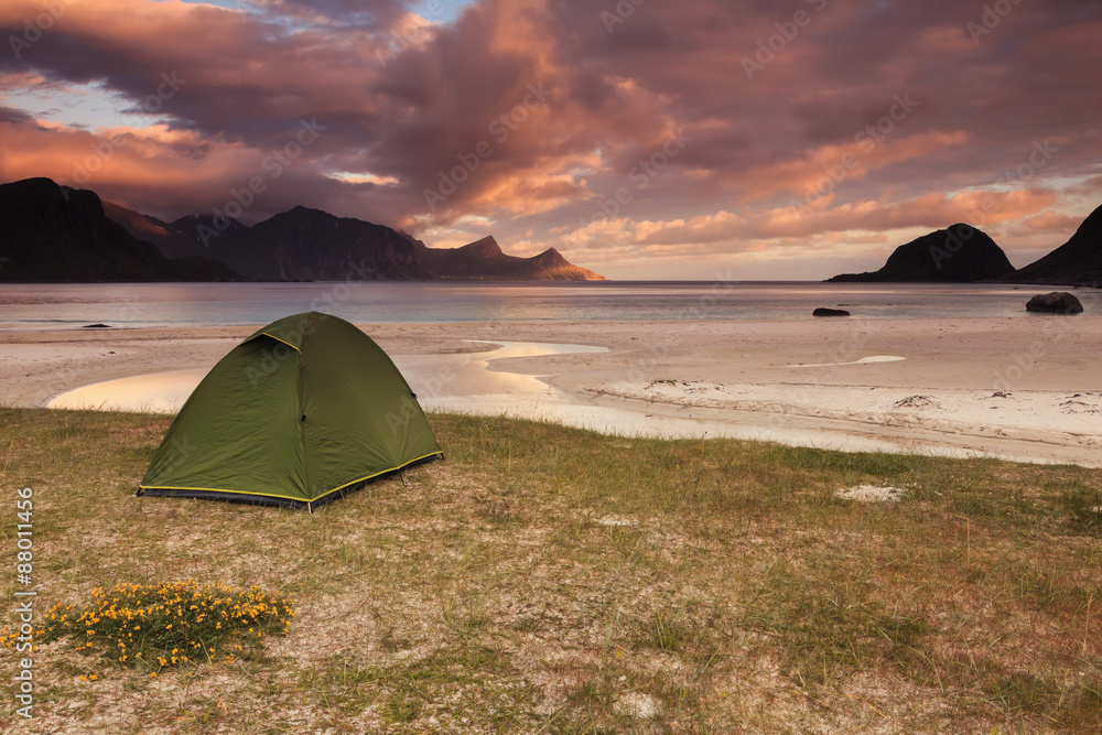 Utakleiv beach in Lofoten islands in Norway. Wild camping during the midnight sun.