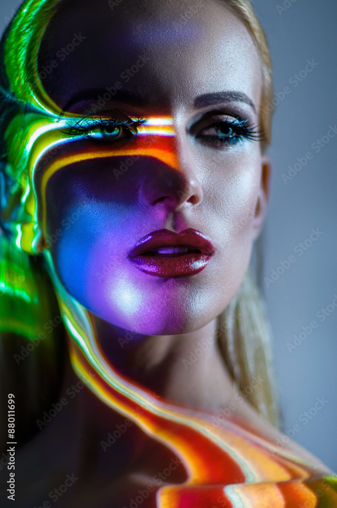 Portrait of blond Woman with shining lights on face