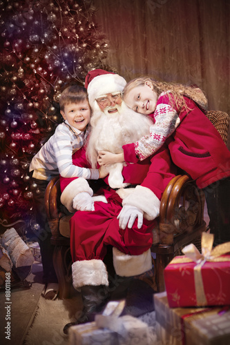Classic Santa giving Christmas Presents to Happy Children.