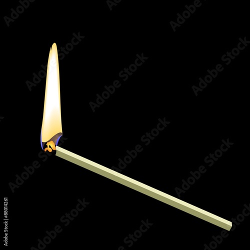 Burning matchstick on black background