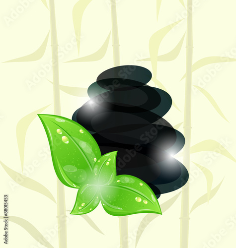 Meditative bamboo background with cairn stones and eco green lea