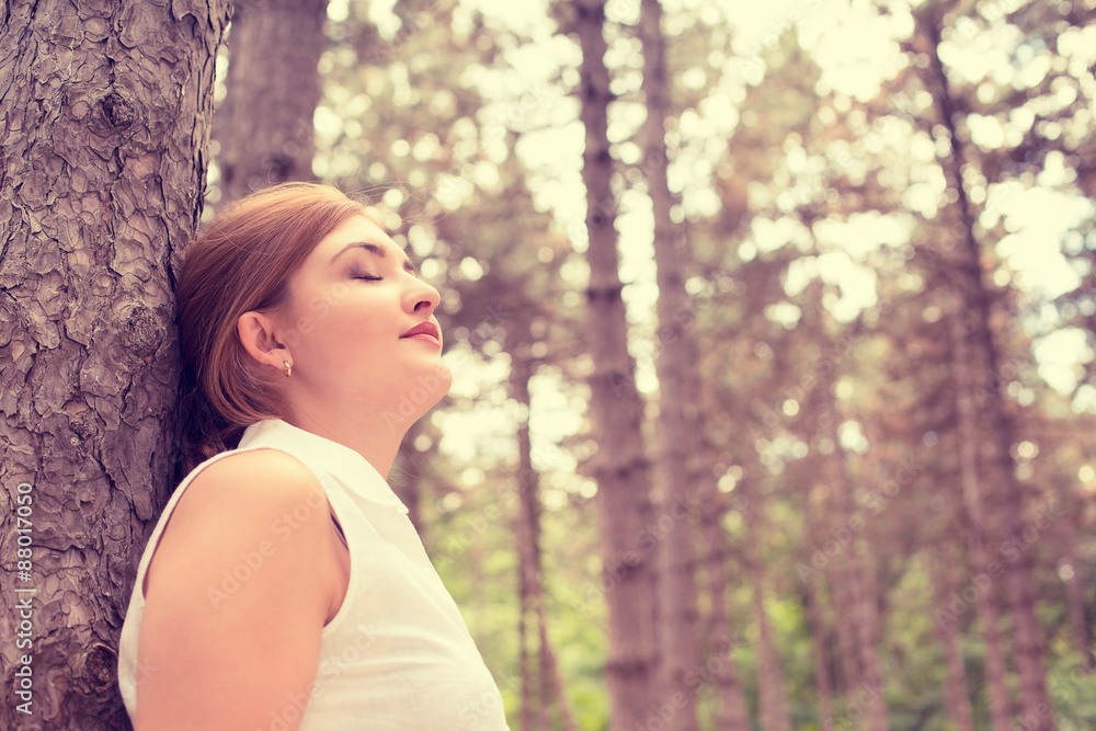 relaxing young woman enjoying summer day in forest taking deep b relaxing young woman enjoying summer day in forest taking deep b