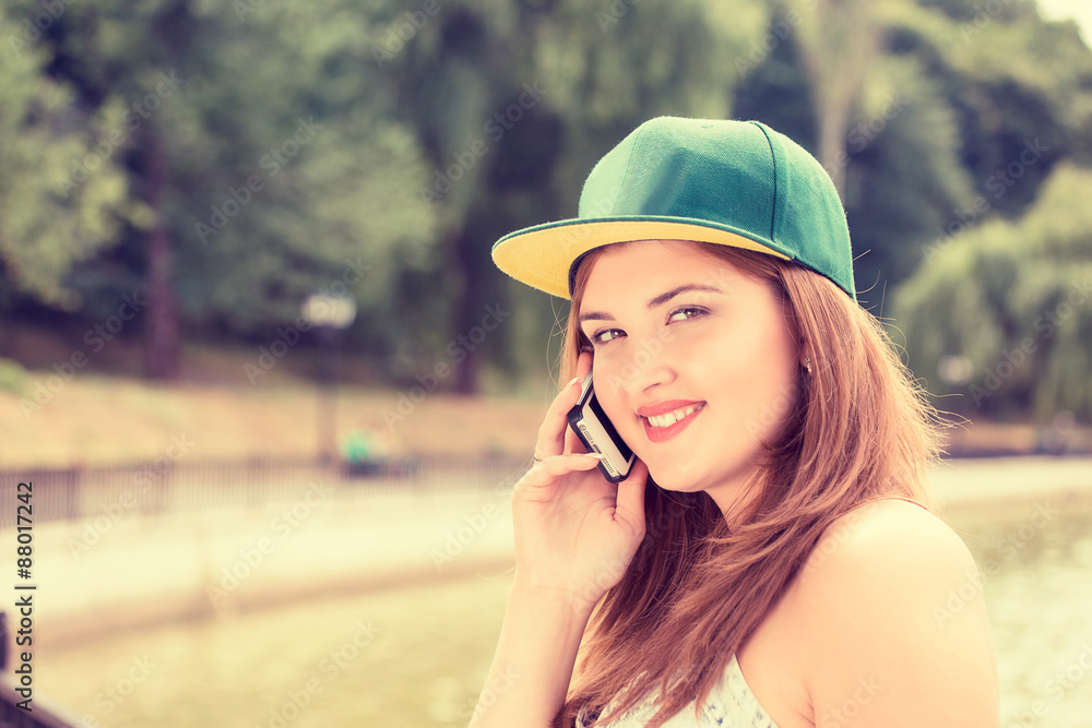 cheerful young happy woman talking on mobile phone
