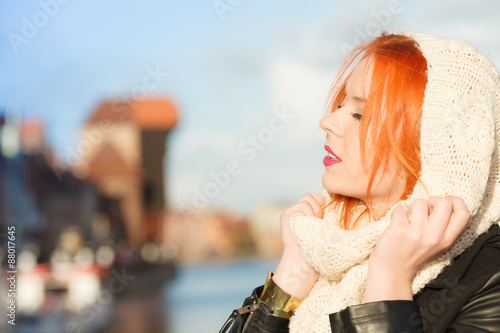 Beauty red hair woman in warm clothing outdoor