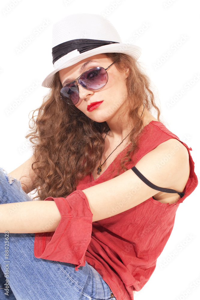 .woman in sunglasses and a white hat .woman in sunglasses and a white hat