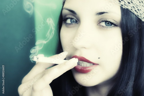  young brunet girl with cigarette