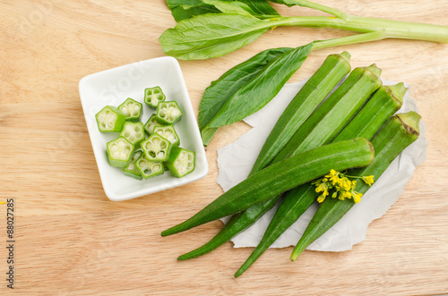 Fotografie Fresh okra on wooden background