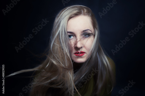 woman with hair fluttering in wind closeup