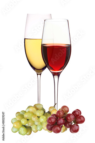 Wineglasses with white and red wine with grapes isolated on whit