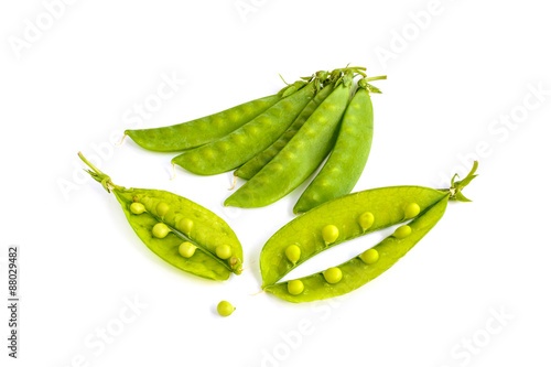 young fresh pods of green peas isolated on white background