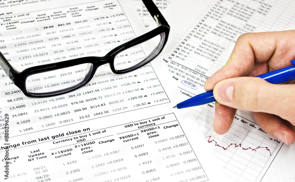 Glasses, financial documents and male hand with pencil
