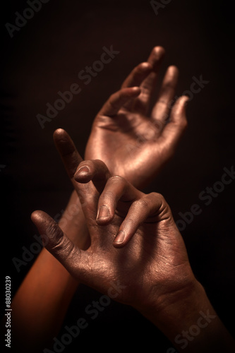 beautiful man's hands in bronze paint © korionov