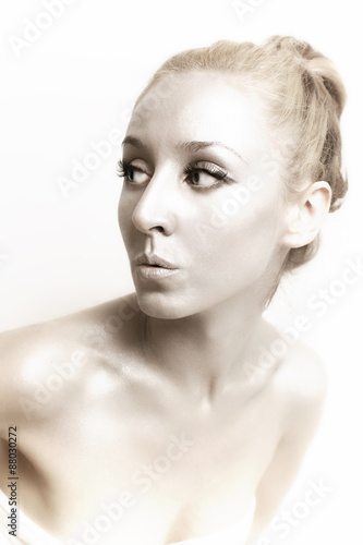 blond woman with shiny silver makeup