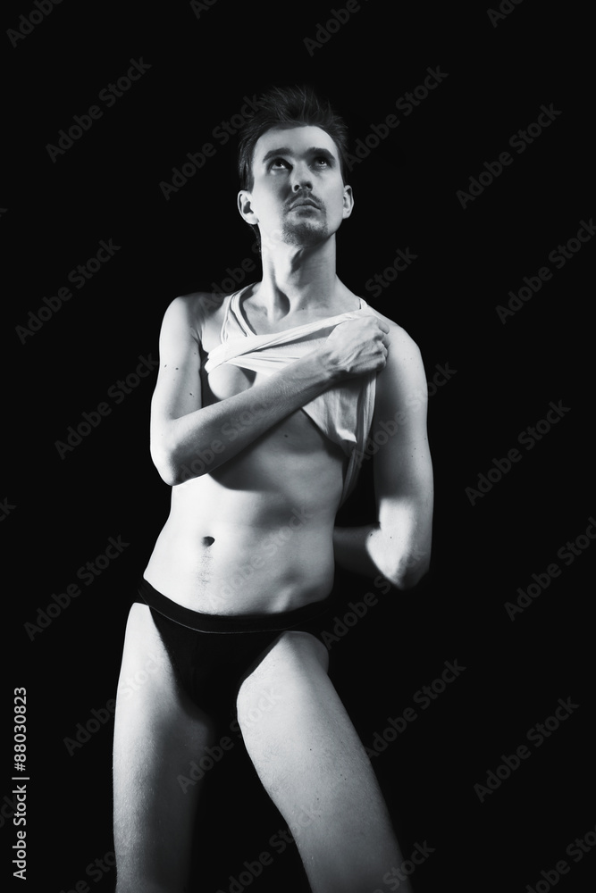 Fototapeta premium young handsome tall young man in shorts and t-shirt