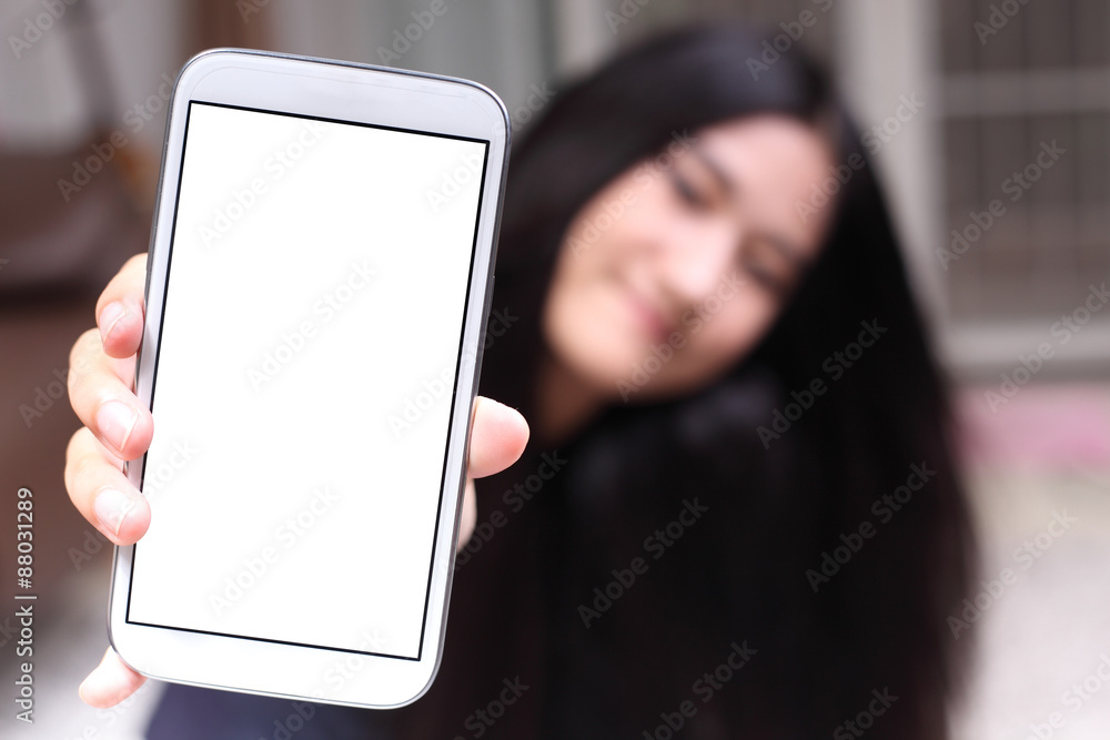 Asian beautiful girl smiling happy using a smartphone . Mixed race Asian Caucasian pretty model