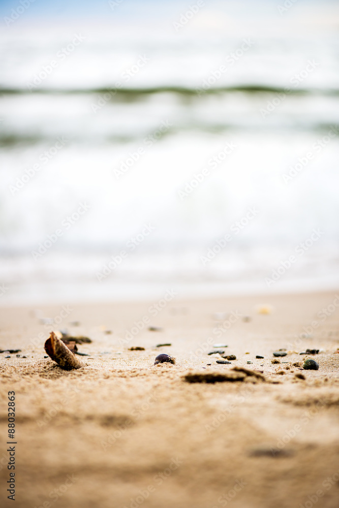 Sandy Beach, Pebbles and Sea on the Background Sandy Beach, Pebbles and Sea on the Background