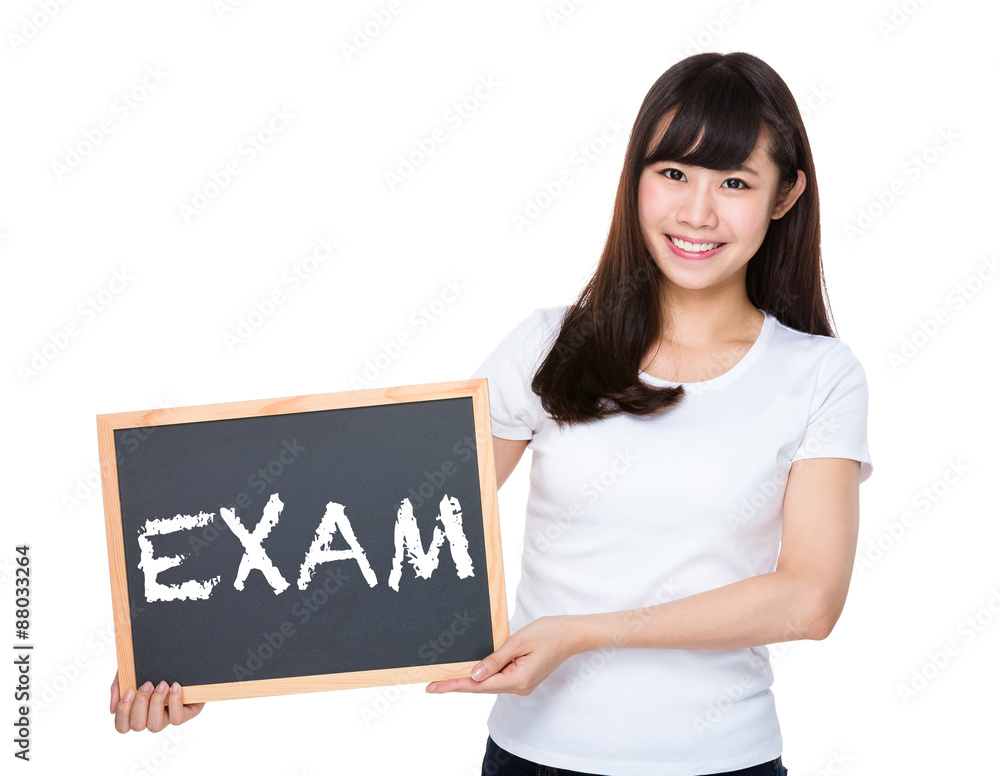Woman hold with chalkboard showing a word exam Woman hold with chalkboard showing a word exam