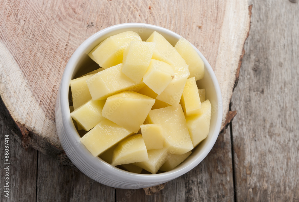 cut raw potatoes in bowl cut raw potatoes in bowl
