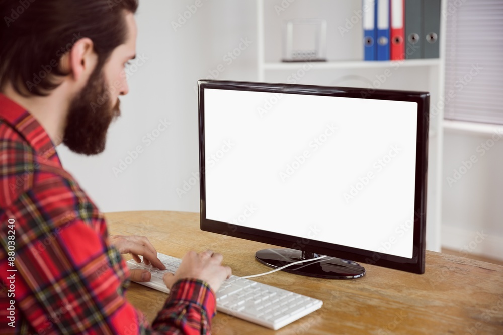 Hipster businessman working on his computer