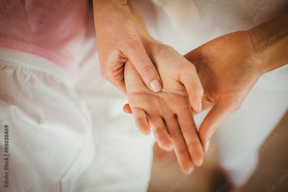 Young woman getting hand massage