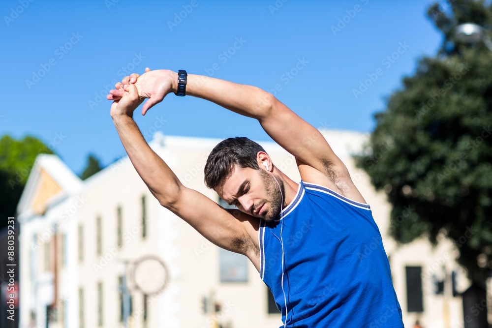 Fototapeta premium An handsome athlete stretching