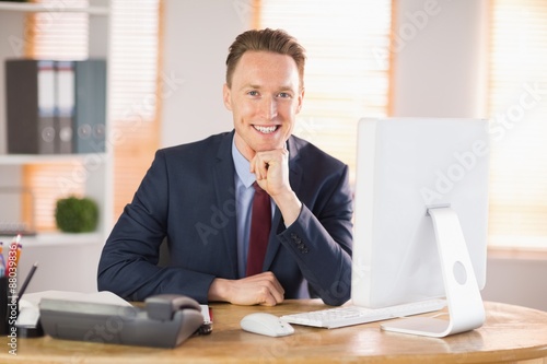 Stylish businessman smiling at camera