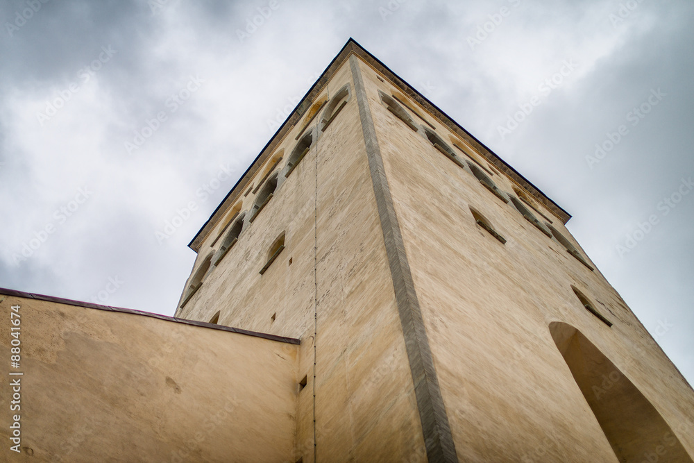 Perspective view of old castle tower and wall.