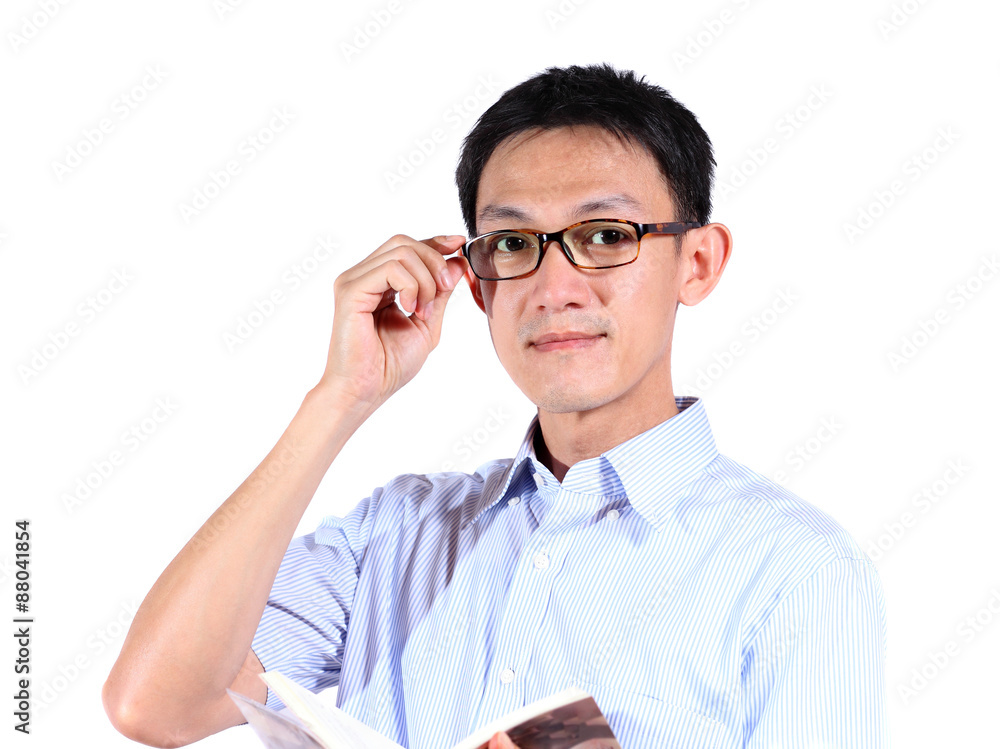 Portrait of young man reading a book isolated over white background