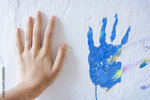 Painted Wall with Blue Hand photo