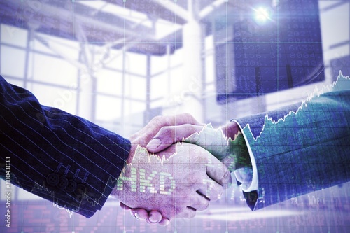 Composite image of business people shaking hands