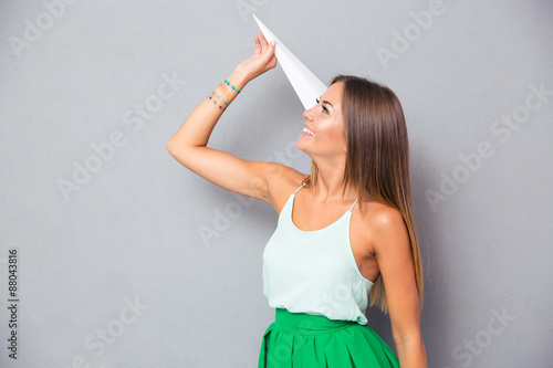 Girl holding paper plane