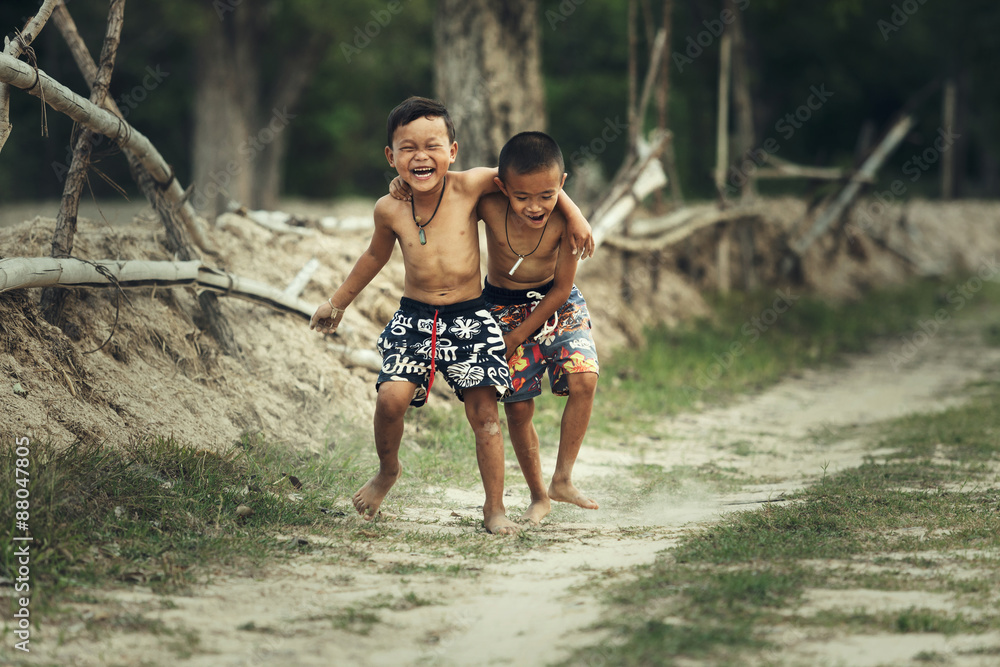 Fototapeta premium Two boys running tease