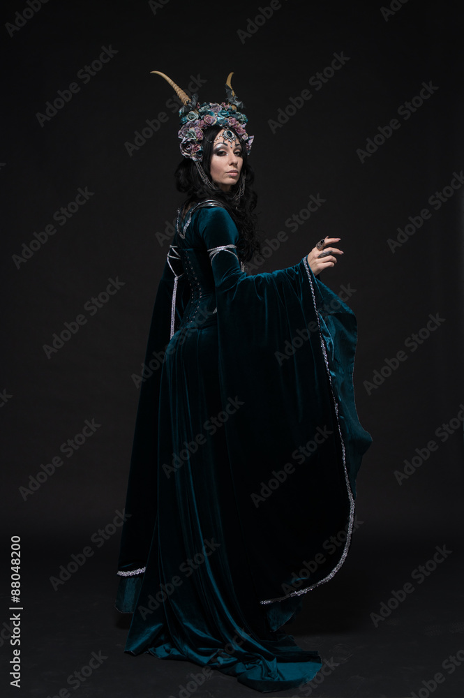 Beautiful fantasy elf woman in flower crown and medieval dress Beautiful fantasy elf woman in flower crown and medieval dress