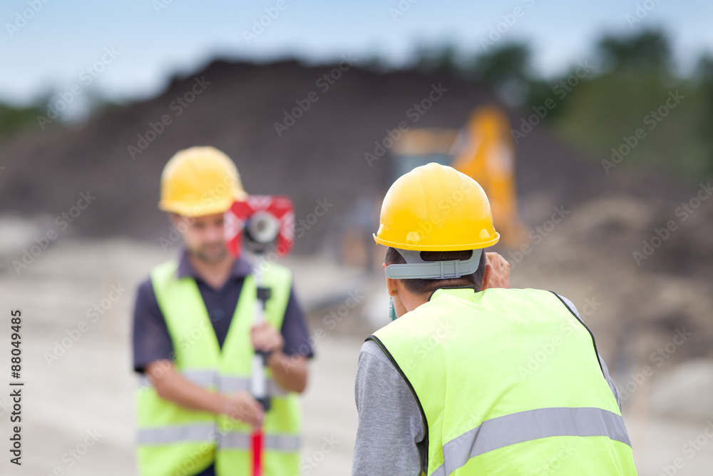 Workers with theodolite Workers with theodolite