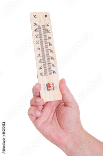 Hand holding thermometer isolated on white © Catalin Pop