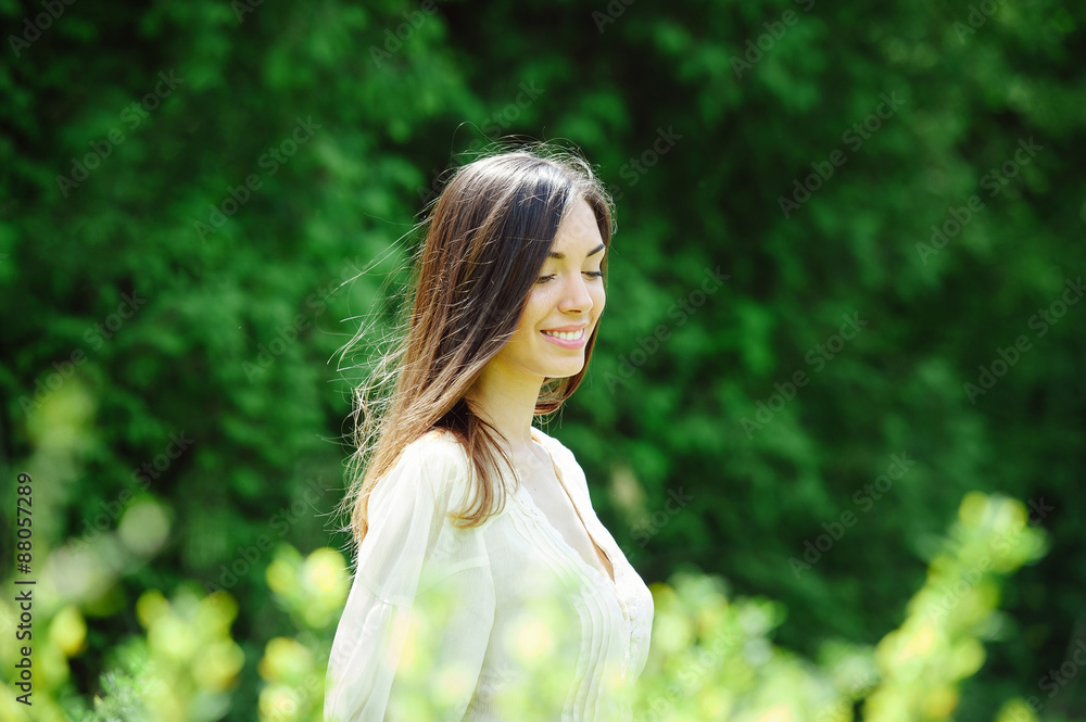 Young attractive woman walking around in blooming spring park Young attractive woman walking around in blooming spring park