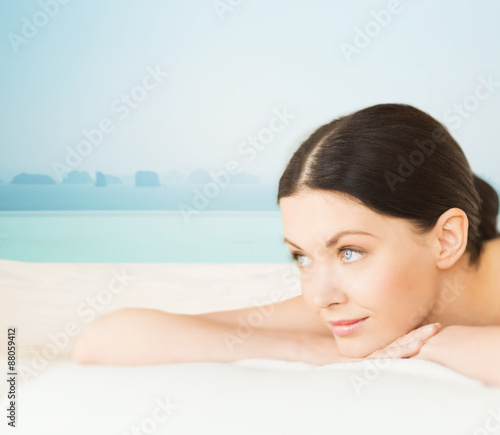 happy beautiful woman lying in spa