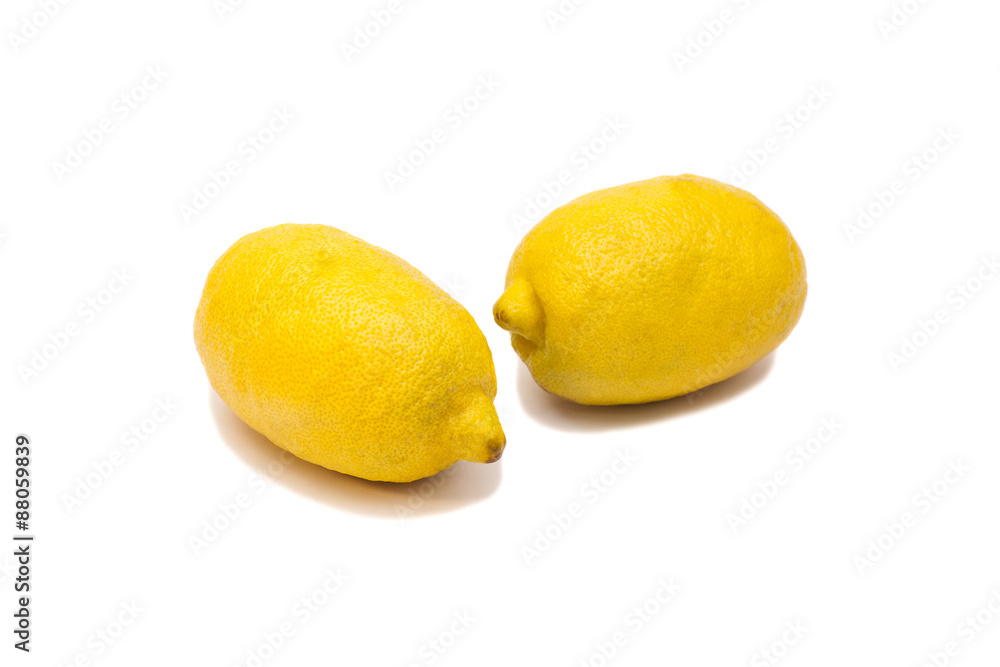 Two ripe lemons. Isolated on white background Two ripe lemons. Isolated on white background
