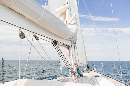 close up of sailboat mast or yacht sailing on sea