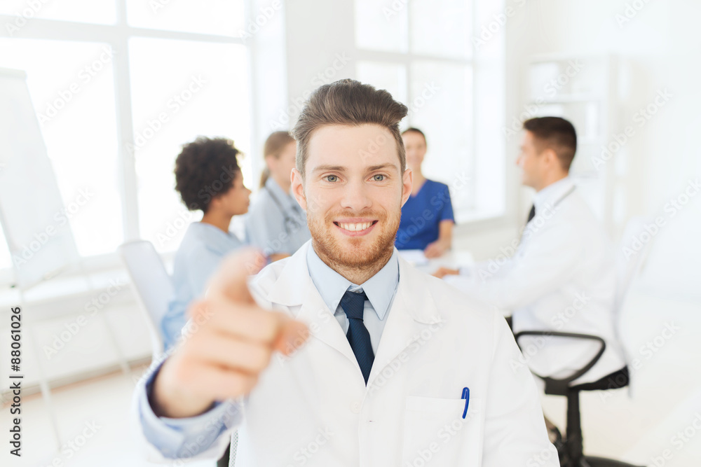 happy doctor over group of medics at hospital happy doctor over group of medics at hospital