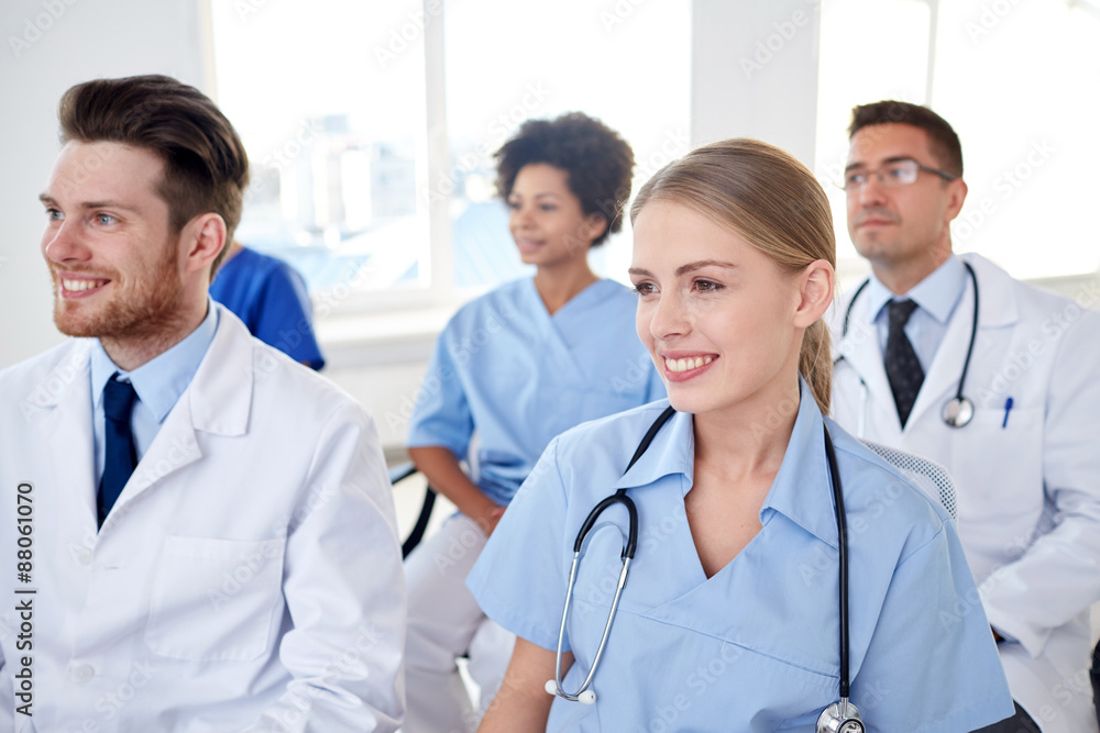 group of happy doctors on seminar at hospital group of happy doctors on seminar at hospital
