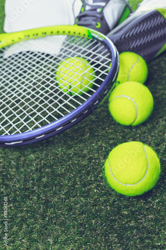 Tennis equipment on grass © fotofabrika