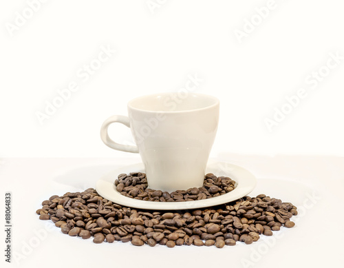Cup of coffee with coffee beans  on white background